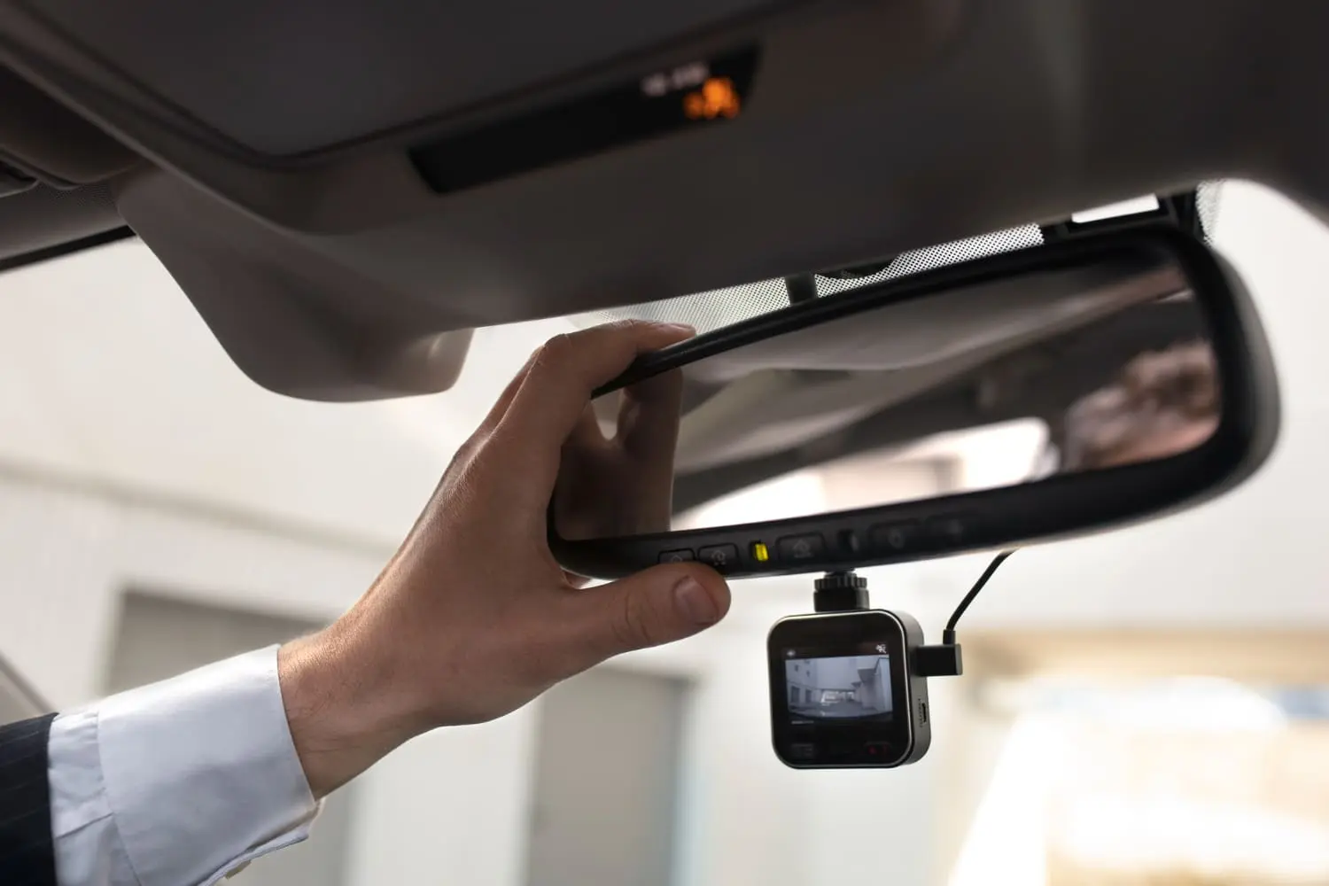 Dash cam with built-in AI mounted on a windshield, a smart driving tech upgrade.