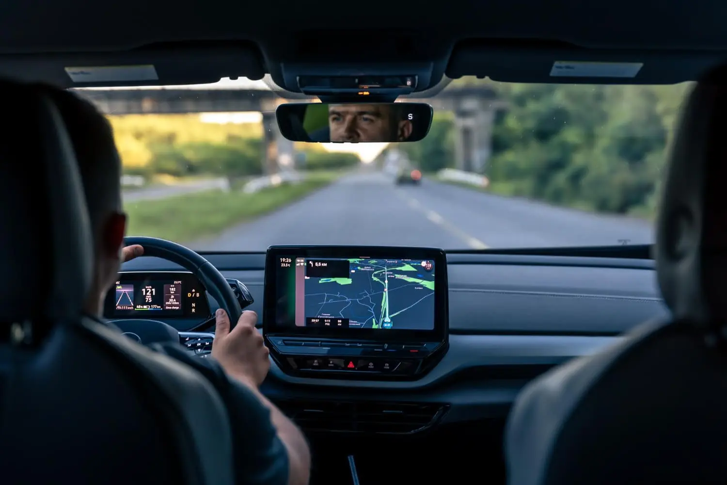 A driver behind the wheel as new safety rules require advanced driver monitoring